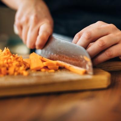 Chef chopping carrots
