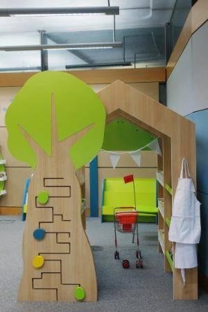 Interactive wooden tree maze game in the Early Years Library play areas 
