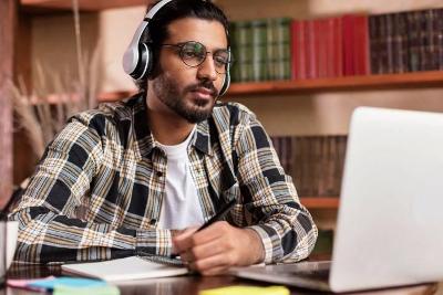 Man listening to course online