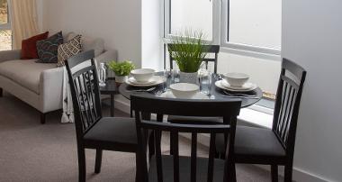 Dining table for four in a Swallowtail Place apartment 