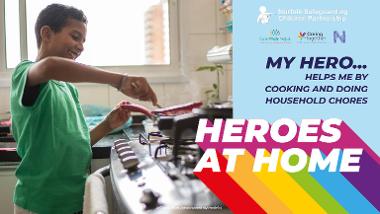 Photo of child cooking food with the text 'MY HERO...HELPS ME BY COOKING AND DOING HOUSEHOLD CHORES HEROES AT HOME'
