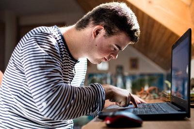 Person typing on a laptop