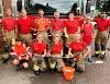A group of Stalham firefighters posing with a fire engine