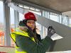 New headteacher Emily McMillen signing the steel framework at the new Silfield Oak Primary school