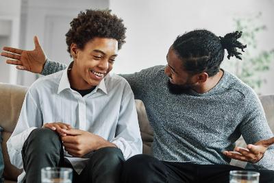 Teen and carer laughing