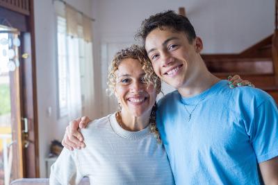 Teen and carer smiling