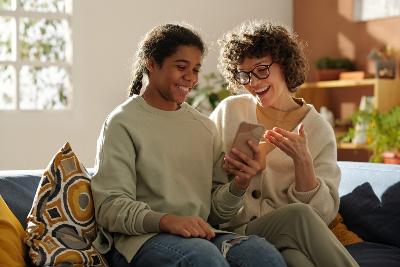 Teen and carer using a phone