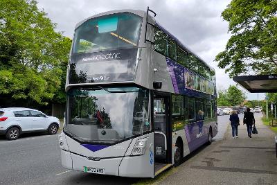 Photograph of electric bus at a bus stop