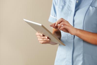 Health professional using ipad