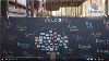 Screenshot of a video showing a welcome display with a drawing of a tree and the word ‘hello’ in different languages. It’s attached to outdoor railings