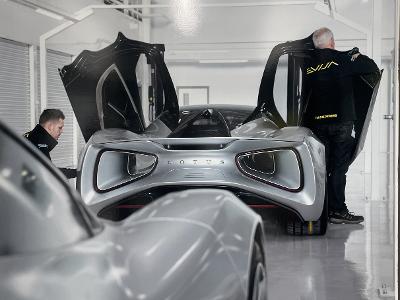 Employees working on a Lotus car