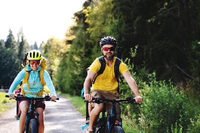 Two people biking