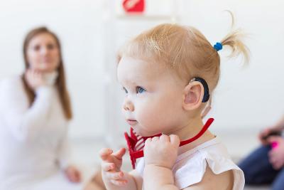 Toddler girl wearing hearing aid