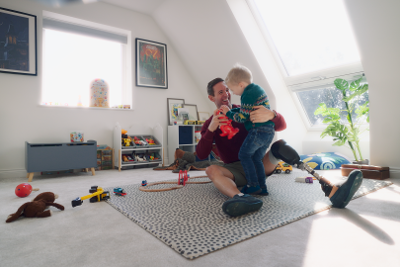 Man playing with child