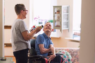 Person in a wheelchair talking to someone