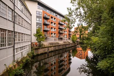 A view of the riverside flats and apartments along the River Wensum captured from St George’s Bridge
