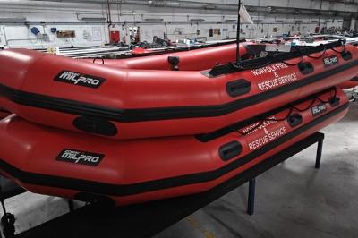 A red lifeboat in a storage building