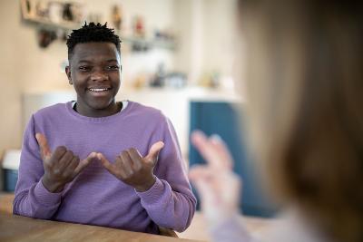 Teenagers using sign language