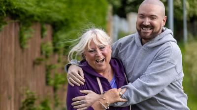 Two carers laughing together