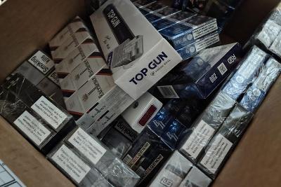 A box filled with illegal packets of cigarettes